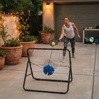 A pickleball player practicing with a training rebounder board on a residential driveway.